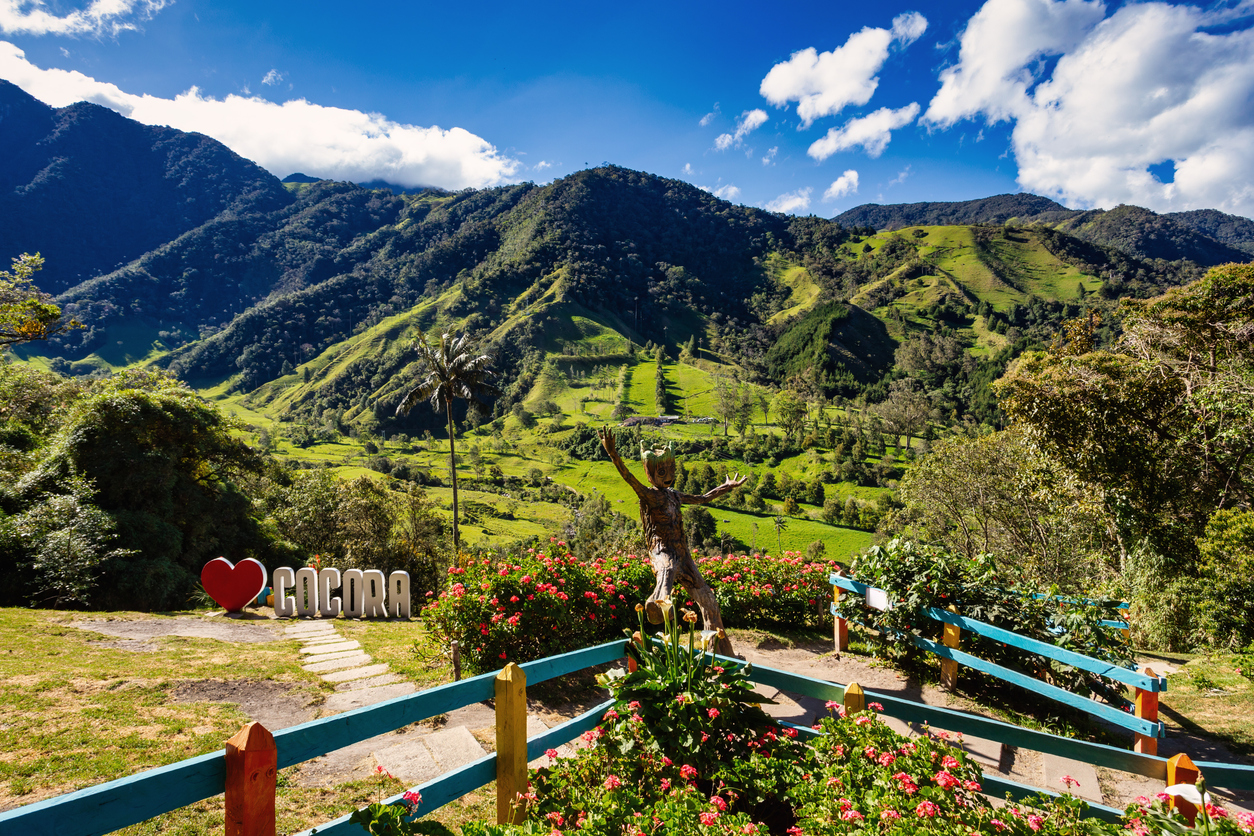 Sign Yo Love Cocora in famous entertainment center Valle del Cocora Valley with tall wax palm trees. Salento, Quindio department. 